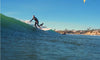 Man Riding A Wave On The Classic Surf