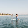 Women Kneeling On The Cruiser Paddle Board