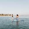 Women Kneeling On The Cruiser Paddle Board