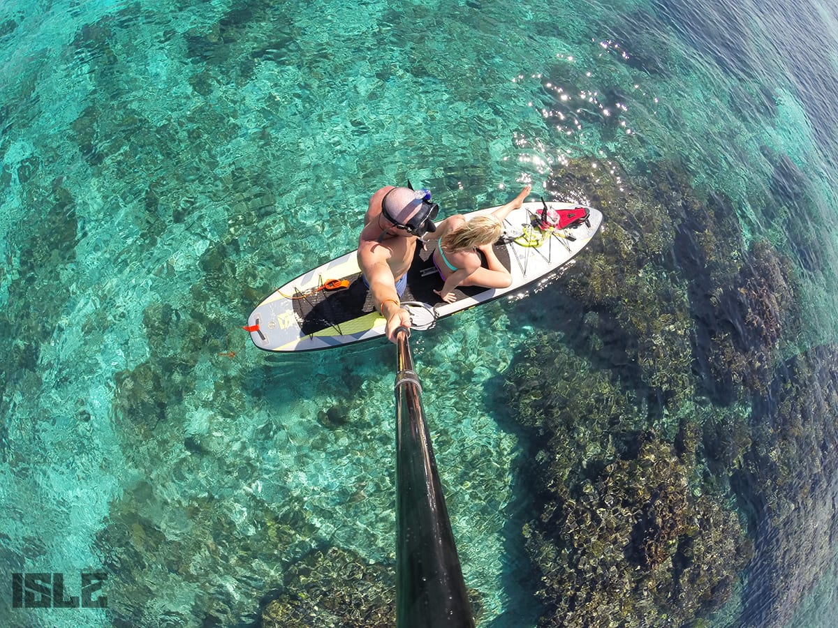 Isle Surf And Sup With Flat Tide Paddle Boarding Through The Reefs