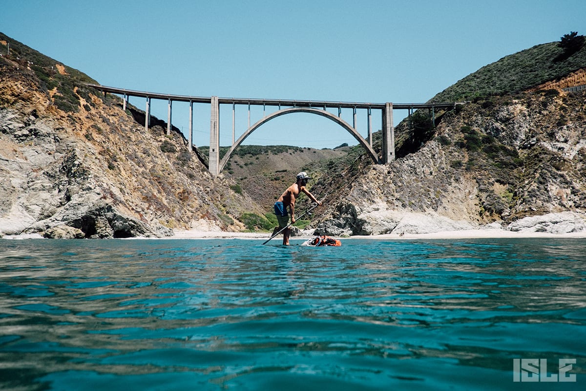 Standup Paddle Boarding On Big Sur Coast In Front Of The Bixby Bridge