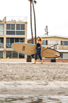 Women Carrying The Glider Paddle Board