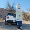 ISLE Pioneer Paddle Board Next to A Jeep
